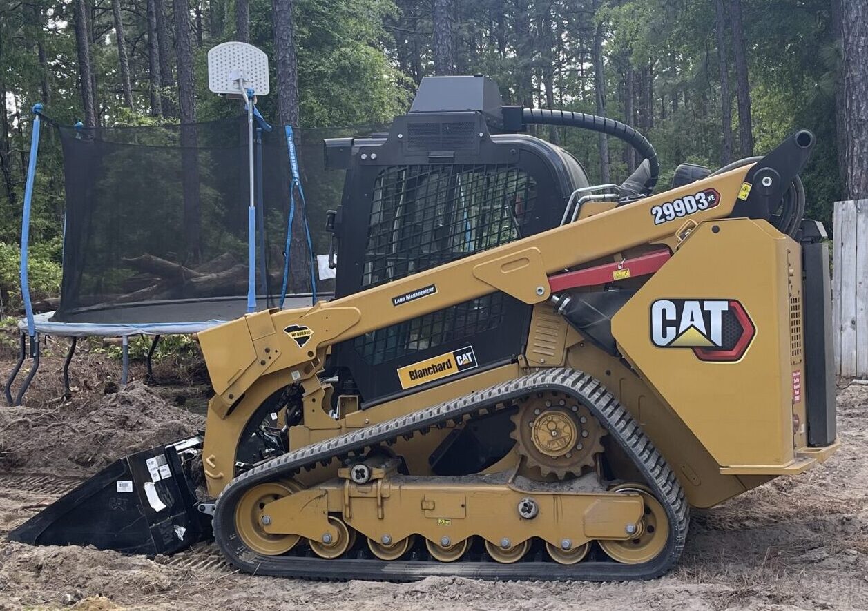 Our Equipment:  Skid Steer is pictured